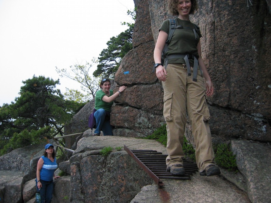 Lisa, Margaret, a grating, and Jen, on the Beehive Trail